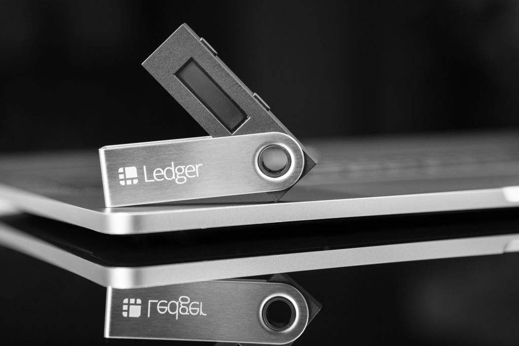 Ledger hardware wallet for cryptocurrency on a black background