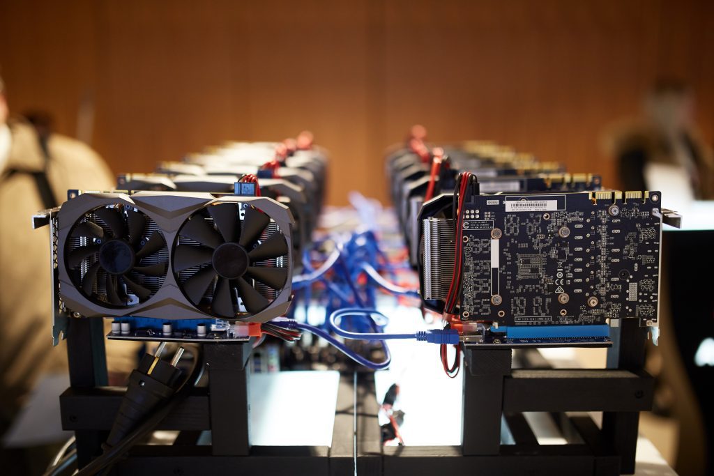 Cryptocurrency mining equipment - lots of gpu cards on mainboard gain money. Proof of Work PoW